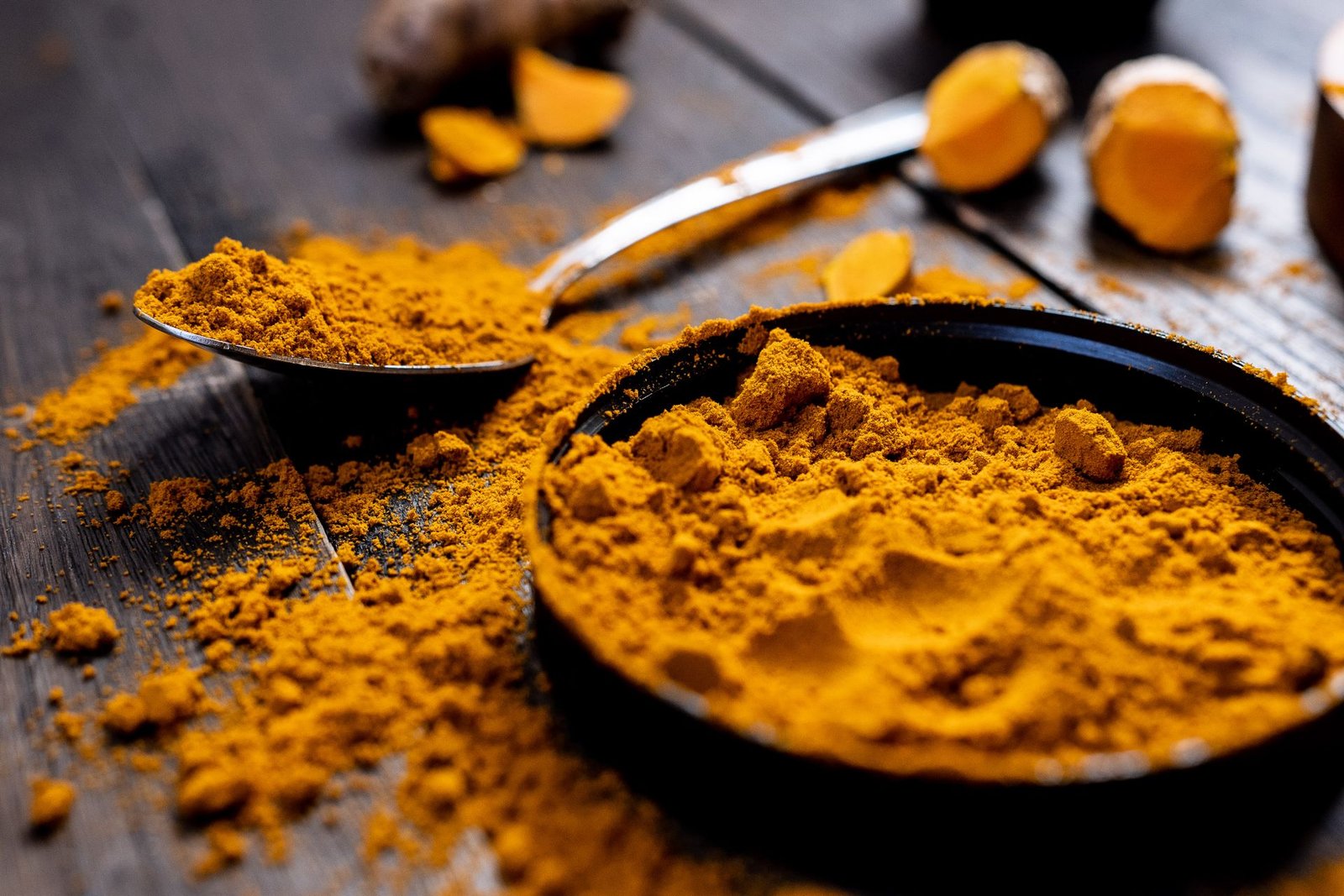 Pure haldi powder with natural colour and fresh turmeric roots